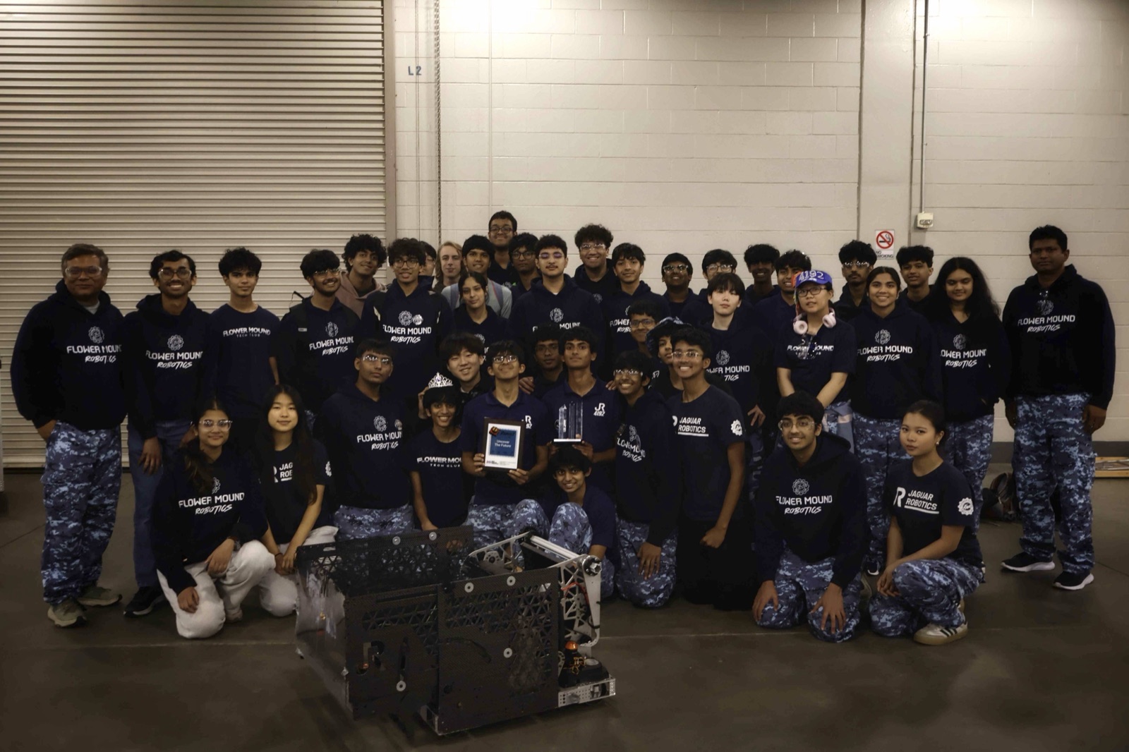 The Flower Mound Robotics team with their robot